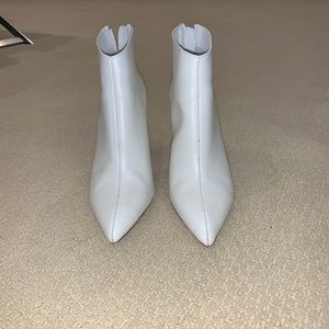 Pointed white leather boots